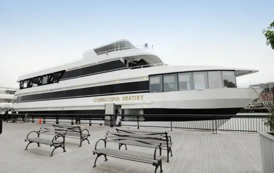The Cornucopia Destiny yacht docked at a New York pier